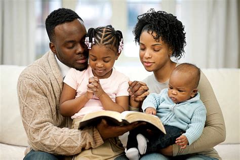 Black Family Praying Together Stock Photos, Pictures & Royalty-Free Images - iStock