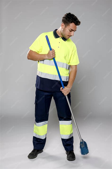 Free Photo | Front view of male janitor with broom