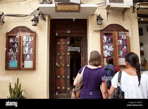 Tourists at Mercury House, where Freddie Mercury lived as a child, Stone Town, Zanzibar, Africa ...