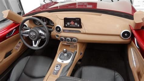 the interior of a sports car with dashboard controls and steering wheel ...