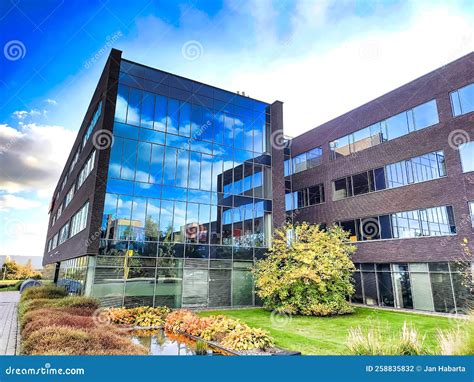 Office Building with Reflection in Windows Stock Photo - Image of building, clouds: 258835832