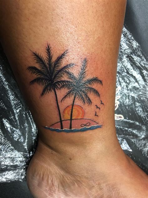 Palm Tree Tattoo with a beautiful sunset on a beach. Infinity in the sand #Hawaiiantattoos ...