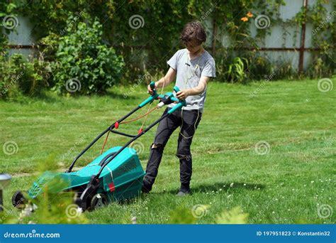 Boy Mowing the Lawn with Lawnmower Stock Image - Image of blossom, gardener: 197951823