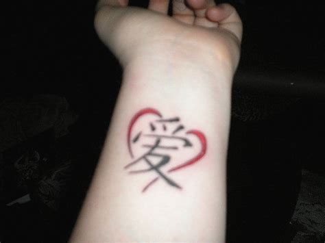 Chinese love tattoo with heart on wrist - Tattooimages.biz