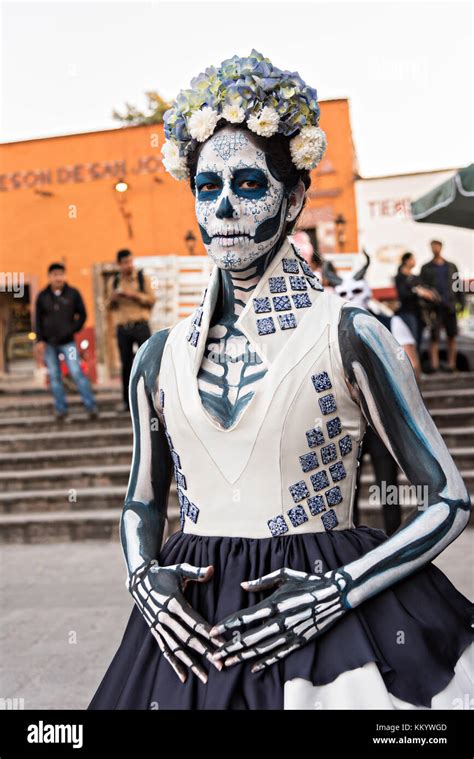 A young Mexican woman dressed in La Calavera Catrina costume for the Day of the Dead or Día de ...