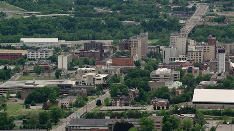 5K stock footage aerial video orbiting the campus of Youngstown State ...