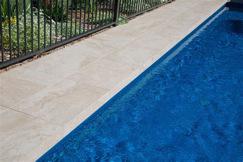 Artisan Exterior | Medium Travertine Porcelain Pavers & Coping