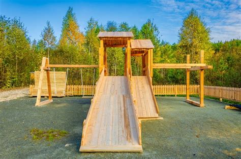 Premium Photo | Wooden slide for children to play on the playground.