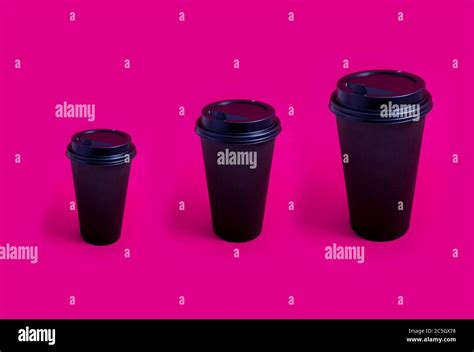 Black takeaway paper coffee cup different sizes over pink background, coffee to go illustration ...
