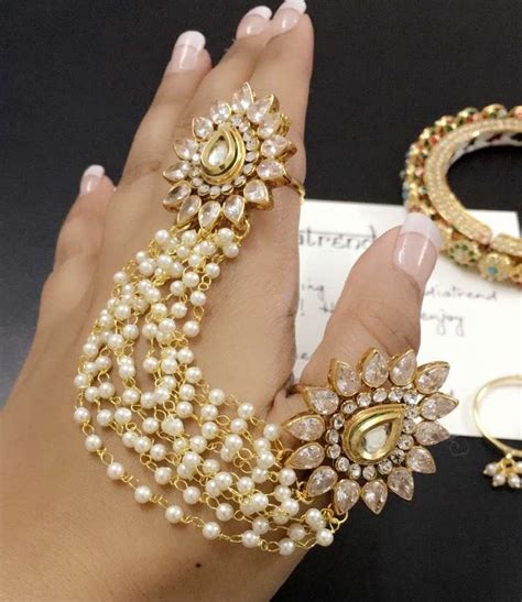 Kundan rings connected with pearl chains @shiilpas | Hand jewelry, Indian jewellery design ...