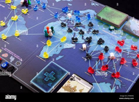 Pandemic strategy board game pieces and cards Stock Photo - Alamy