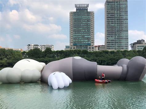 KAWS: HOLIDAY.. The sculpture will be on view for one month in the Seokchon Lake in Seoul, Korea ...