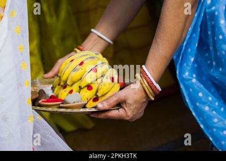 Varan or boron ritual being performed during hindu marriage or puja by traditional Bengali woman ...