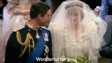 the bride and groom look at each other as they stand in front of an audience