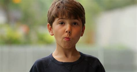 Expressive Child Becoming Angry As He Hears News Young Boy With An Expressive Look On His Face ...