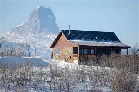 Cabin in the winter and landscape at Glacier National Park, Montana ...