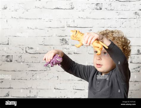 a young child playing with animals Stock Photo - Alamy