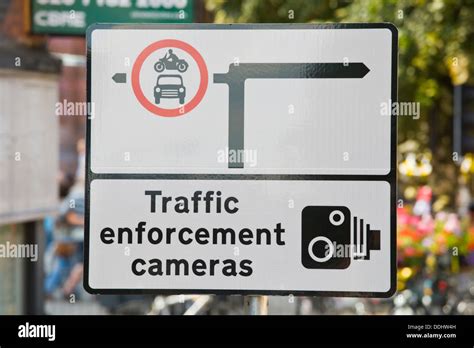 Sign for TRAFFIC ENFORCEMENT CAMERAS on road junction in the city of ...