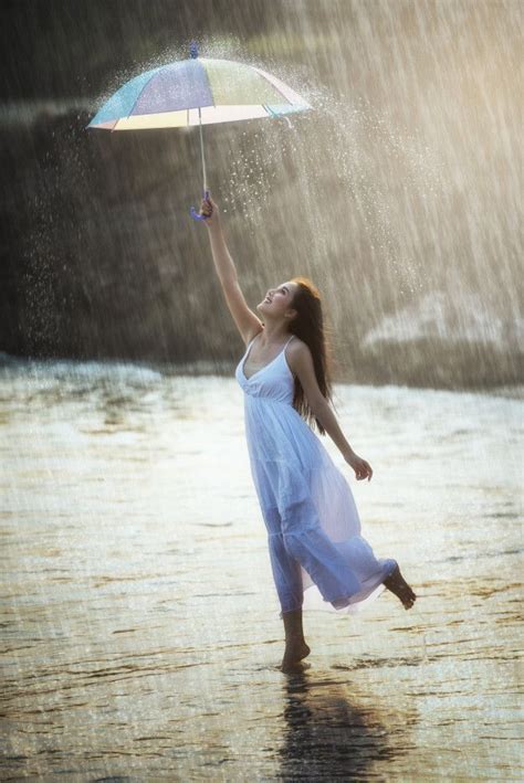 Premium Photo | Pretty young woman with rainbow umbrella, under summer rain | สาว, ผู้หญิง, การ ...