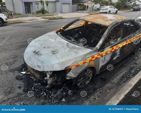 Burnt out car in road stock image. Image of road, insured - 167298457