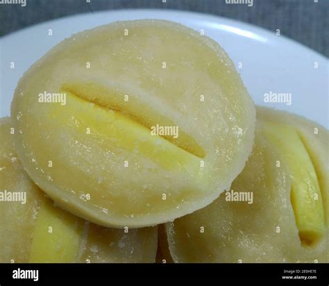 Close up shot of freshly baked Filipino dessert rice cake with cheese toppings in a soft ...