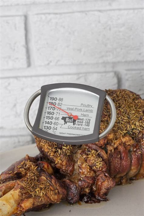 Meat Thermometer Checking Temperature in a Roast Leg of Lamb. Stock Photo - Image of checking ...