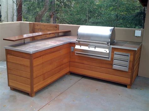 An Outdoor Barbeque Island That Looks Like Wooden Furniture - Fine ...