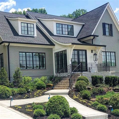 Gray painted brick with black windows and look at that roof line ... 🤩 Note on the second photo ...