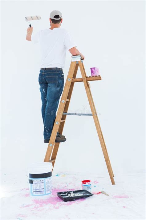 Man on Ladder Painting with Roller Stock Photo - Image of holding ...