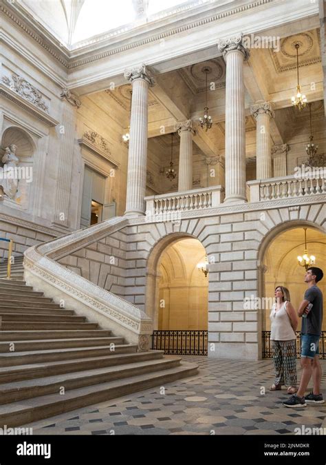 Two tourist looking inside of the Opera house with stairs Stock Photo - Alamy