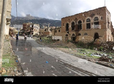 Taiz Yemen 29 Apr 2021 : Yemenis walking on the rubble of houses destroyed by the war in Yemen ...