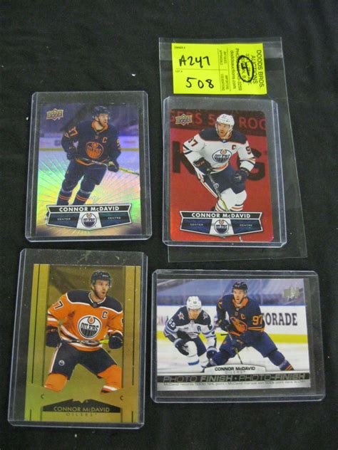 4 CONNOR MCDAVID HOCKEY CARDS