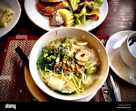 Cambodian breakfast: noodles fruits, pancakes, omelette and coffee Stock Photo - Alamy