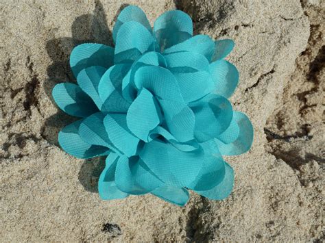Turquoise Fiber Flower On Sand Free Stock Photo - Public Domain Pictures