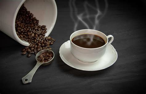 Steaming cup of black coffee Photograph by Karen Foley