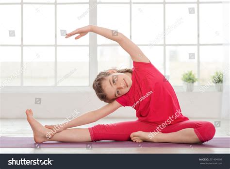 Little Girl Doing Yoga Exercise In Fitness Studio With Big Windows On Background Stock Photo ...