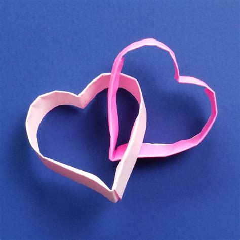 Interlocked hearts that I made for Valentine's Day by folding 2 strips of paper (without cuts or ...