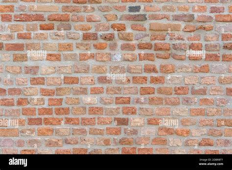 Old red brick wall as seamless texture or background Stock Photo - Alamy