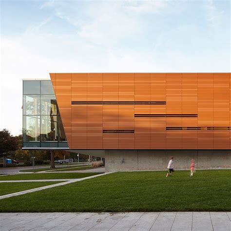 A library that spans a river and a 1970s building wrapped in terracotta panels are among the ...