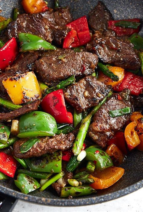 Hunan beef with peppers and asparagus. The classic spicy hunan beef ...