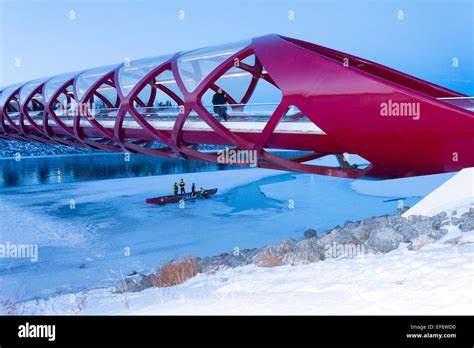 The Peace Bridge in winter over the frozen Bow River, Calgary, Alberta ...