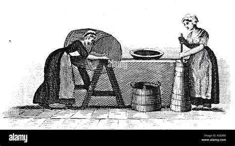 Engraving depicting a butter maid making butter. Dated 19th Century ...