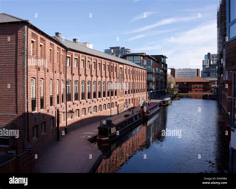 Canal and modern canalside architectural development Birmingham UK with Birmingham and Worcester ...