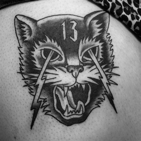 Black and grey lucky 13 cat for this girls first tattoo. So cool. Message me for info and ...