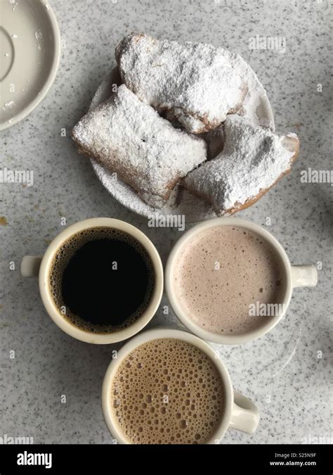 Beignets and coffee Stock Photo - Alamy