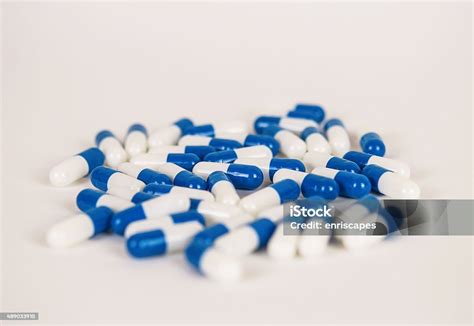 Blue And White Capsules Stock Photo - Download Image Now - 2015, Blue, Capsule - Medicine - iStock