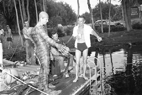 Director Jack Arnold, right, and Ricou Browning with crew on the set of "Revenge of the Creature ...