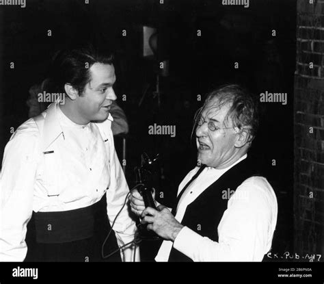 ERSKINE SANFORD and ORSON WELLES on set candid during filming of CITIZEN KANE 1941 director ...