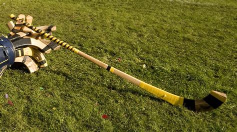 Shinty Stick Laying on a bag of Shinty Sticks | HockeyGods