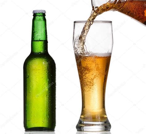 Beer pouring in a glass from a green bottle — Stock Photo © Santiaga #64964283